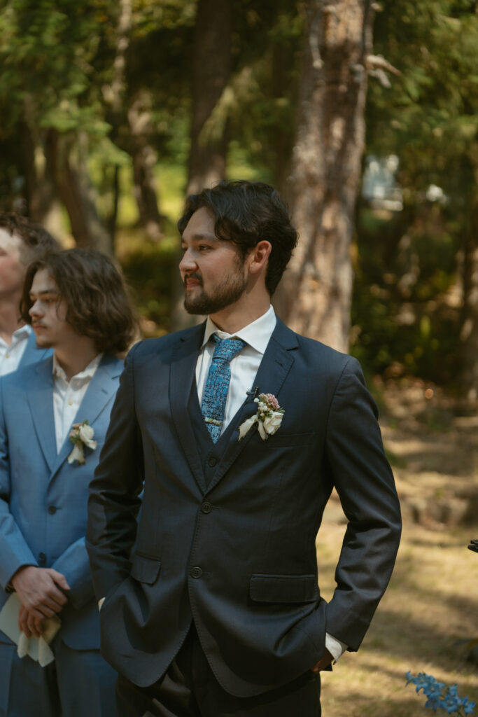 Emotional groom as he sees his bride walk down the aisle during their wedding ceremony.