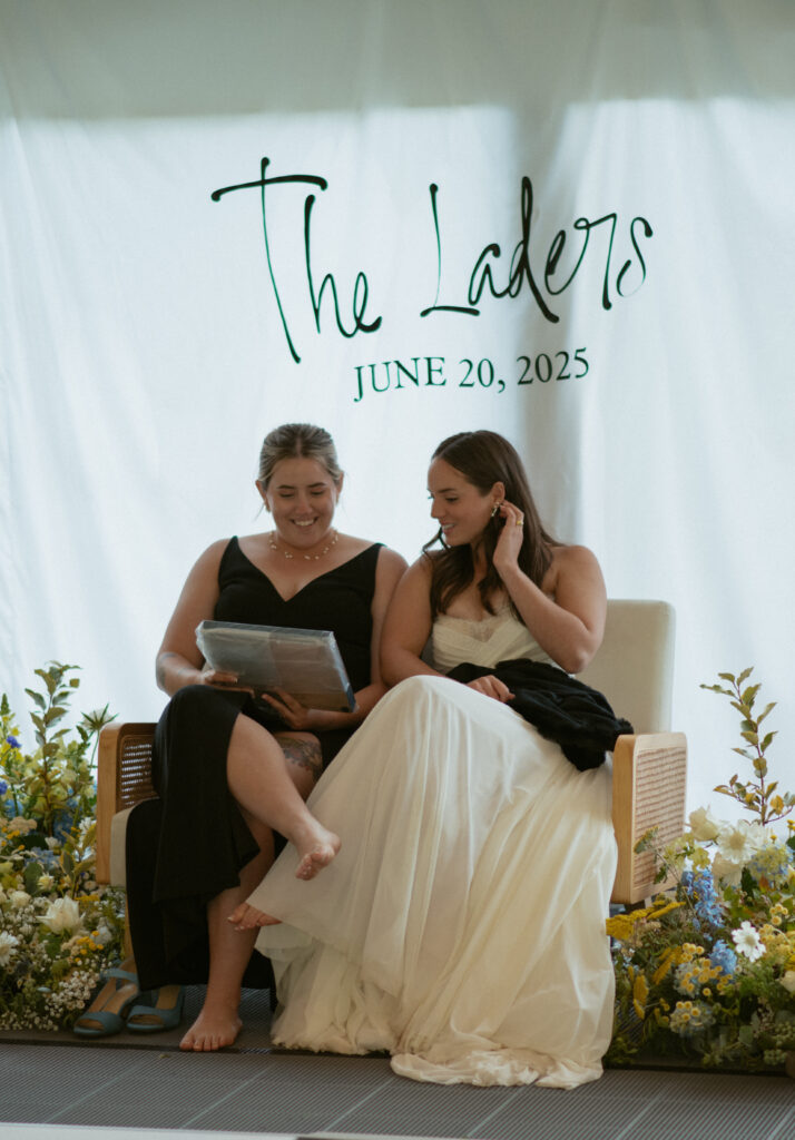 couple looking at a gift that was given during speeches