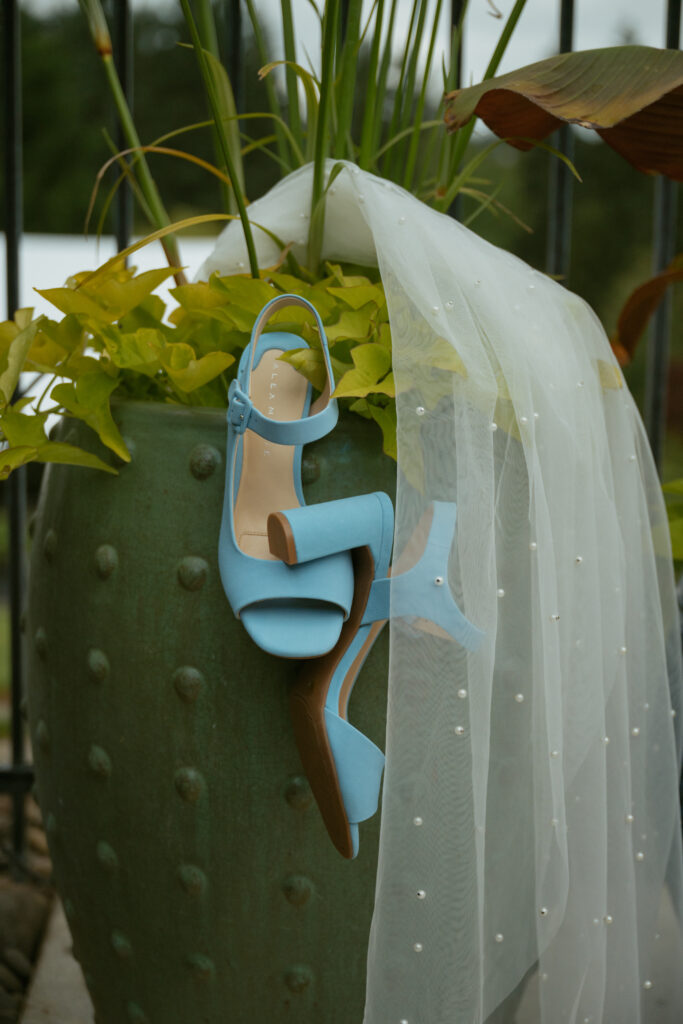 Brides details at the outdoor backyard wedding venue with friends before the ceremony.