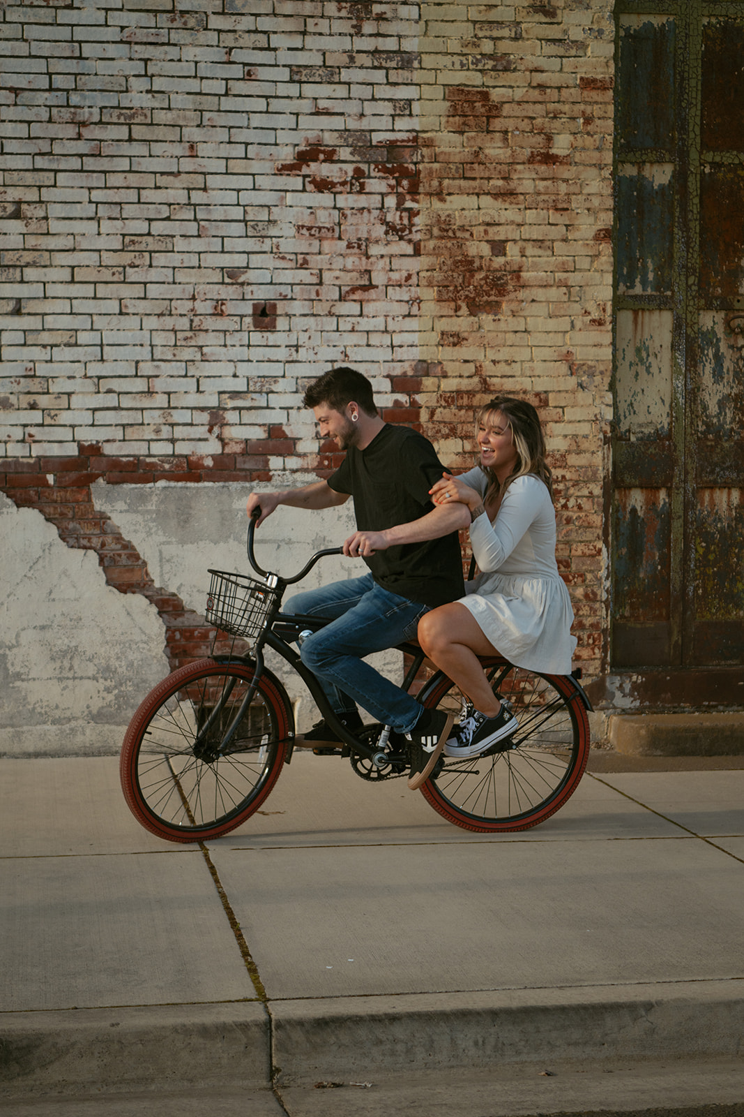 couple session riding bikes downtown