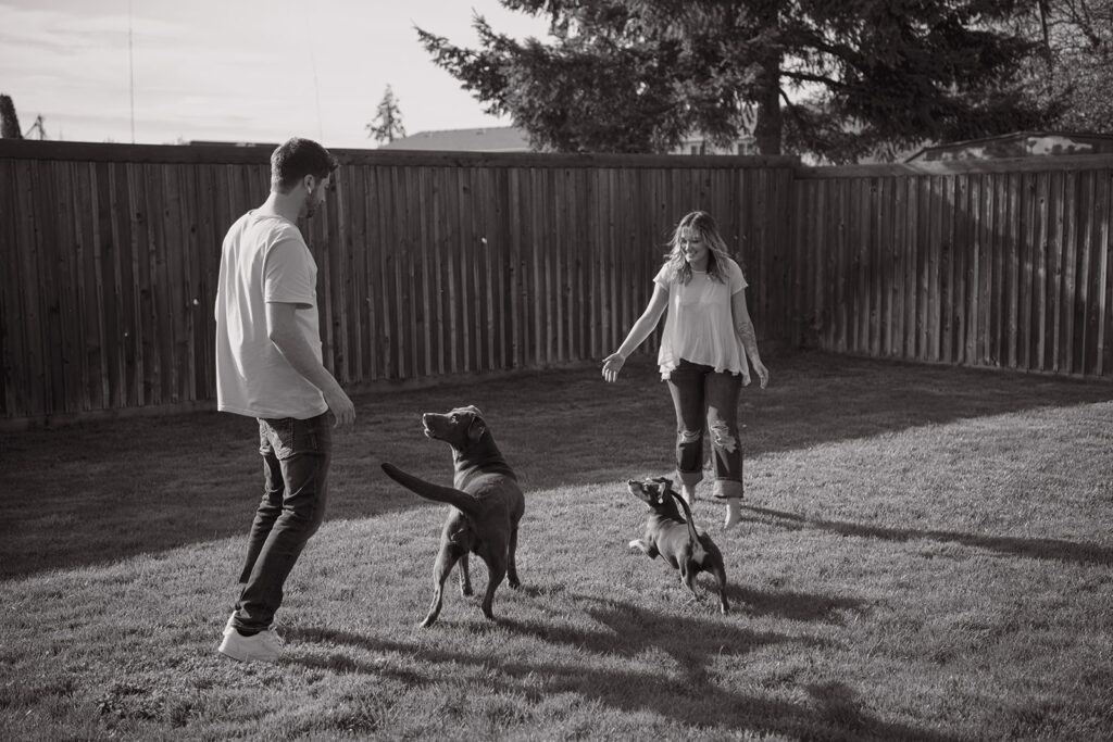 eugene oregon playing with dogs in backyard