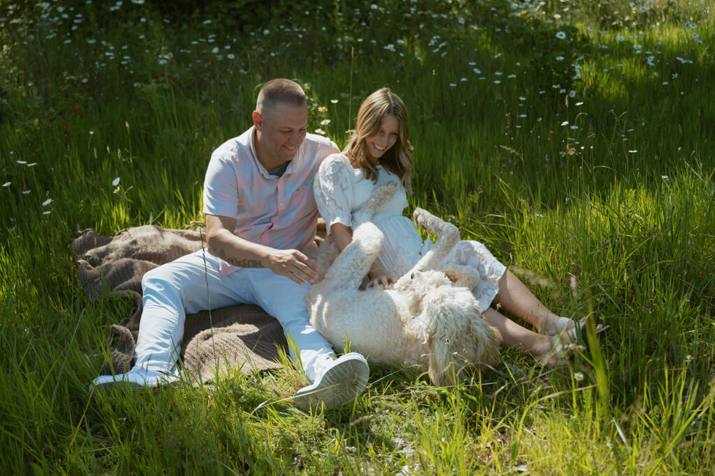 couple sitting with their dog at elijah bristo state park