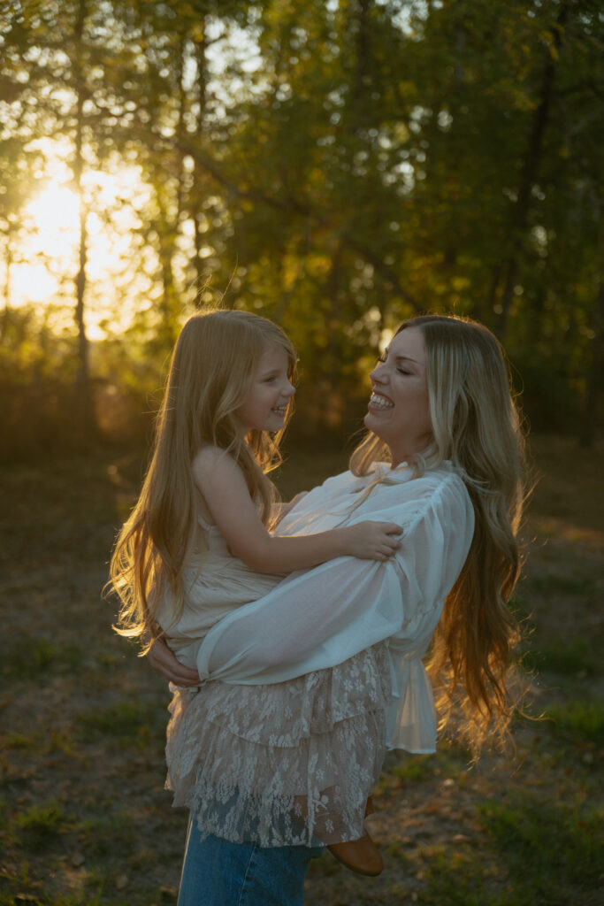 A mom holding her daughter